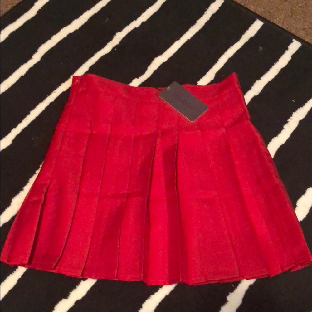 Red pleated mini skirt